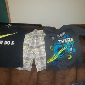 2 boys shirts 5t one long sleeve and on t-shirt and a pair of plaid shorts.